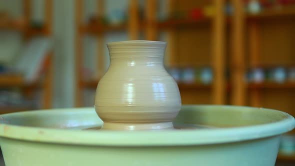 Potter Hands Sculpts a Vase From Clay on a Potter Close Up