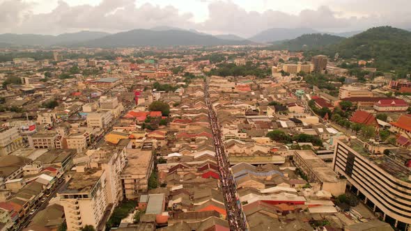 Aerial view Drone flying over phuket city Thailand.Drone over a street night market in Sunday day alt
