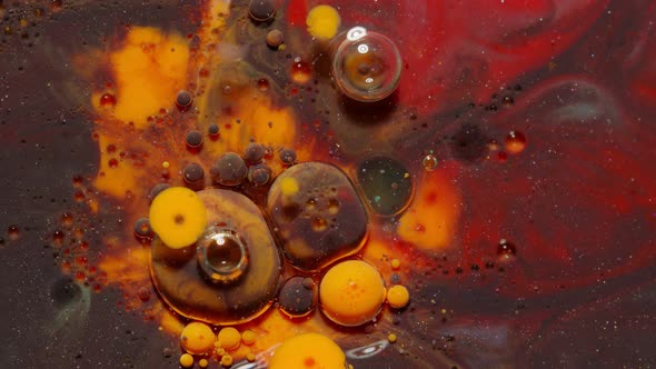 Ink Bubbles Mixed with Liquid Substance of Oil Milk Soap Bright Acrylic Paint on Colorful Surface alt