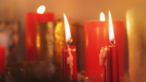 Close-up of candles burning alt