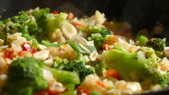 Lunch of Vegetables. Cook the Vegetable Stew in a Pan. Frozen Vegetables on a Salad. Semi-finished