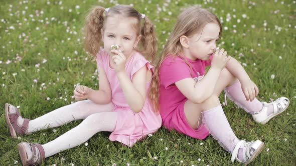 Two Lovely Little Girls in Pink Smiling at Camera