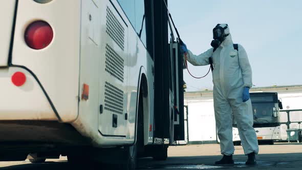 Coronavirus Prevention, Sanitary Disinfection Process. Bus Entrance Is Getting Chemically alt