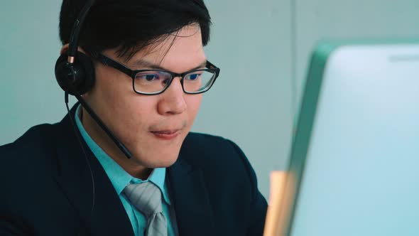 Business People Wearing Headset Working in Office alt
