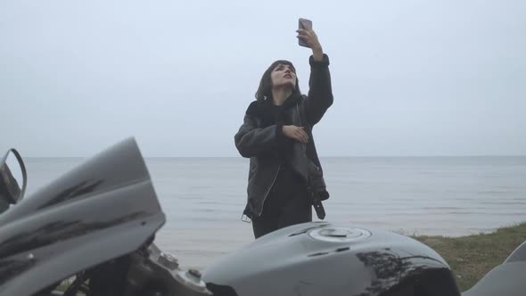 Sad Caucasian Woman Trying To Search for Mobile Network on River Bank. Portrait of Young Beautiful alt