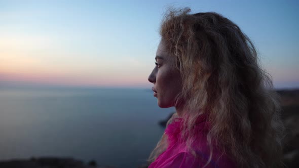 Close Up Shot of Beautiful Young Caucasian Woman with Curly Blond Hair and Freckles Looking at alt