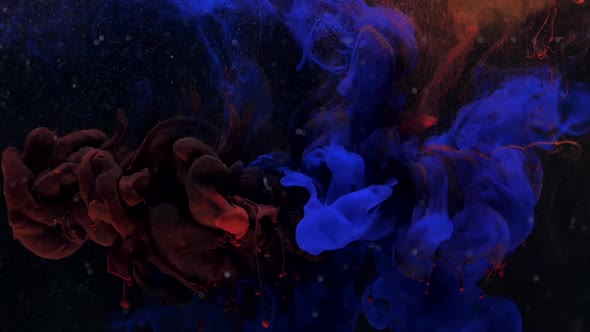Amazing Blue and Red Ink Acrylic Mixing in Water Swirling Softly Underwater alt