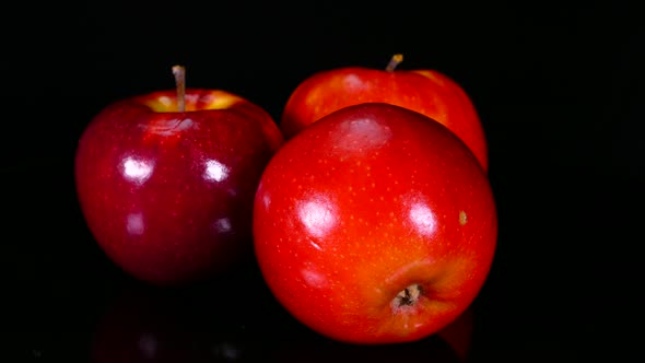 Ripe Red Apples on a Black Background