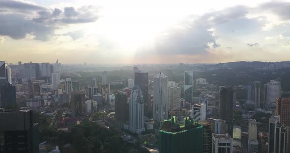 Aerial Footage of the City Center, Kuala Lumpur, Malaysia, Drone Goes Above the Buildings, Sunset