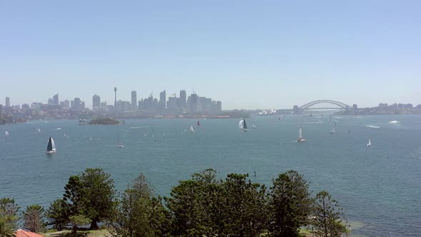 Yachts and Boats in Sydney Harbor in the Summer Flying over Shark Island alt