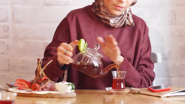 Beautiful Muslim Business Woman in Hijab Drinking Tea in Cafe by ...