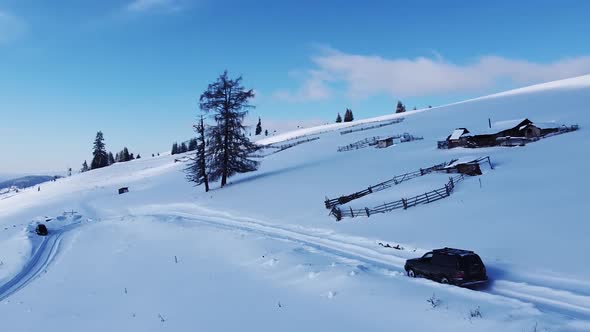 Winter Landscape Of Road Covered In Snow On Mountain With A SUV