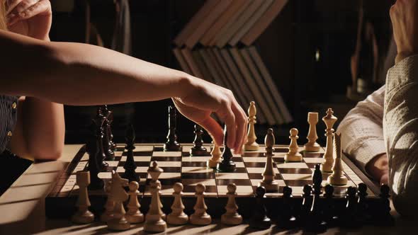 Couple Playing Rapid Chess in the Living Room alt
