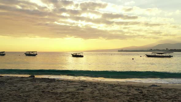 Aerial drone scenery of beautiful shore beach lifestyle by blue sea with white sand background of ad alt