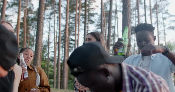 Young African and European Friends are Dancing and Chilling at the Party in Forest Summer Camp