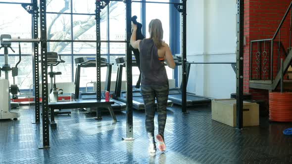 Fit Girl Entering a Fitness Club and Preparing for the Training