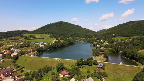 Aerial view of a lake in the village of Bansky Studenec in Slovakia alt