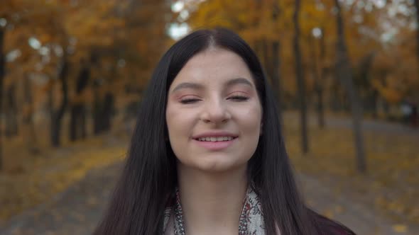 Smiling Woman Looking at Camera Female Portrait Autumn Walking at Park