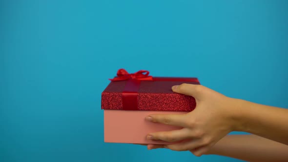 Give Present To Each Other Open Gift Box and Disappointment Show Dislike