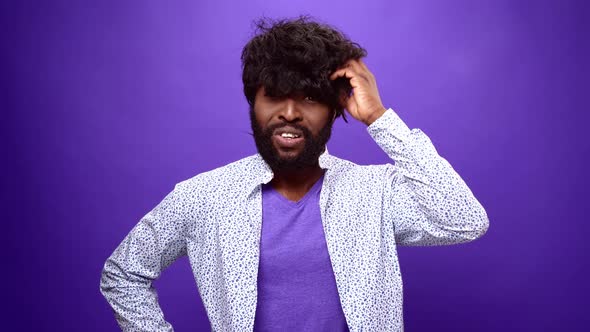 Young African American Man Thinking Purple Studio Background alt
