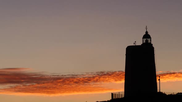 Sunset Sky and Lighthouse on Coast, Spain alt