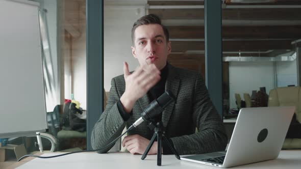 Businessman Talk To Camera Make Conference Business Call Record Audio Talk in Microphone and Looking alt