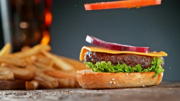 Super Slow Motion Shot of Falling and Stacking Parts of Cheeseburger at 1000Fps alt