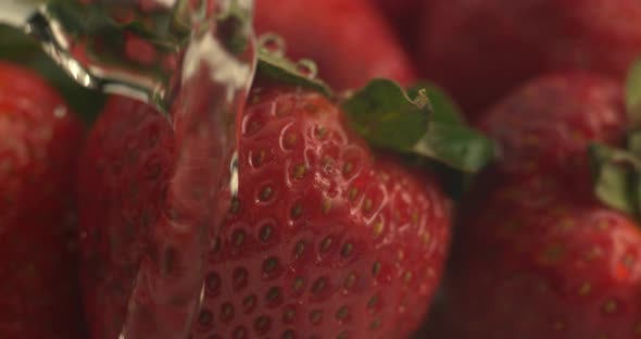 Water dripping onto strawberries in super slow motion.  Shot on Phantom Flex 4K high speed camera.