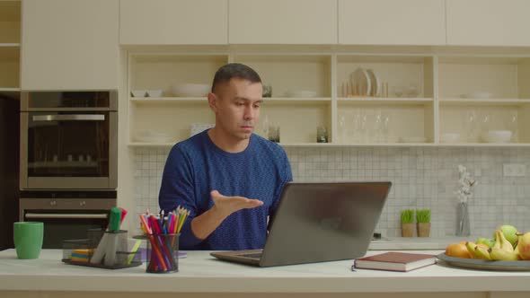 Hearing Impaired Man Making Video Call on Laptop Speaking with Sign Language alt