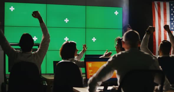 Ground Crew Celebrating in Control Room alt