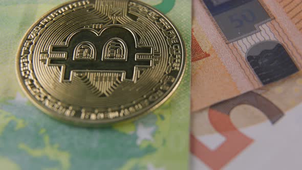 Bitcoin Coins Lie on Euro Banknotes