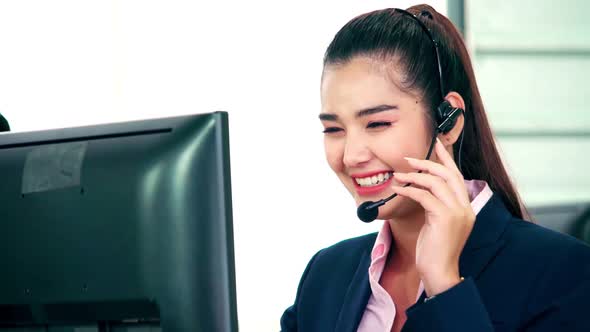 Business People Wearing Headset Working in Office alt