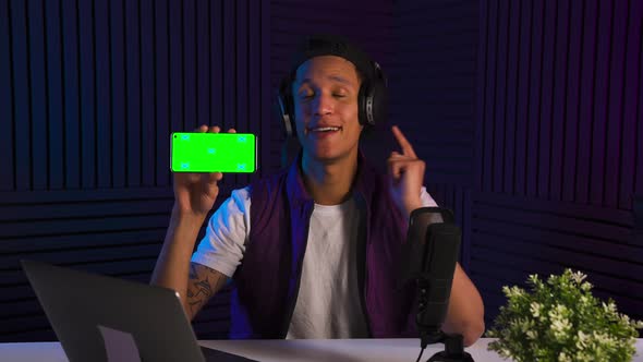 Vlogger Multiethnic Guy Emotionally Talking About Smartphone Application