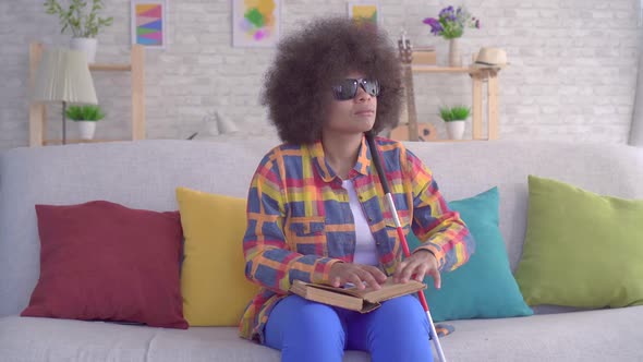 Portrait African American Woman with an Afro Hairstyle Visually Impaired Reading a Book with Your alt