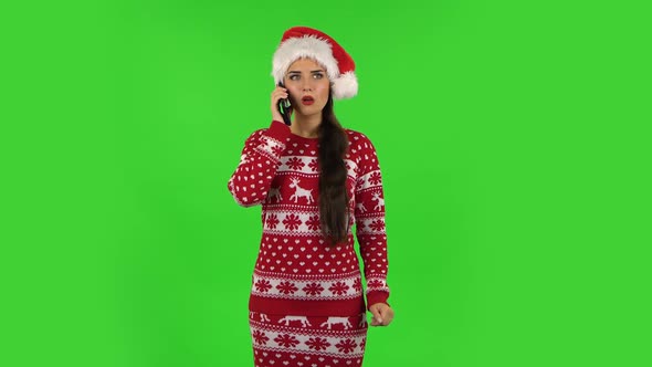 Sweety Girl in Santa Claus Hat Very Shocked Then Upset. Green Screen alt