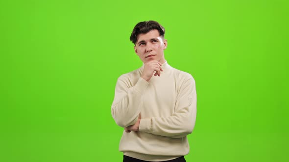 The Man is Standing and Looking at the Camera alt