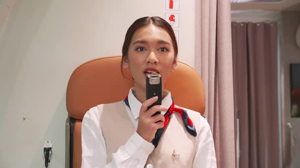 Flight attendants are announcing important messages and information to passengers alt