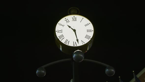 A street clock, at night alt