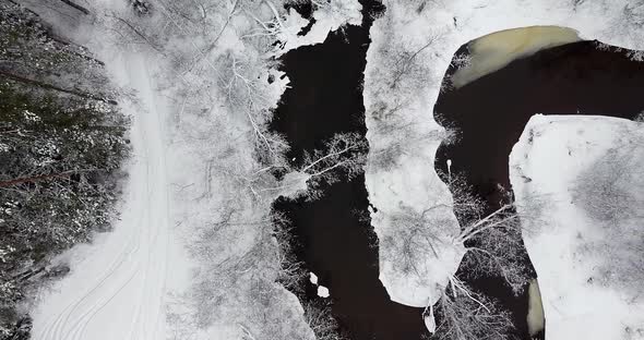 Twisted River Meanders Through Beautiful Winter Landscape alt