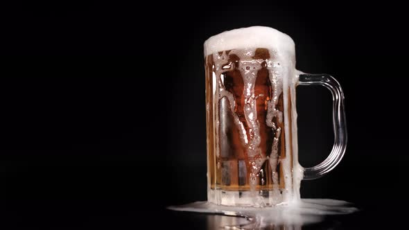 Beer Pouring And Overflow From Beer Mug