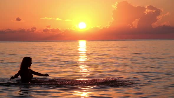 Girl Bathing In the Sunset Sea