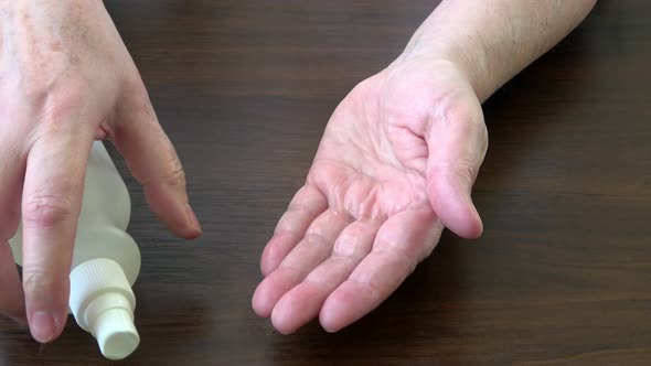 Spraying antiseptic solution on hands. Hand and skin disinfection