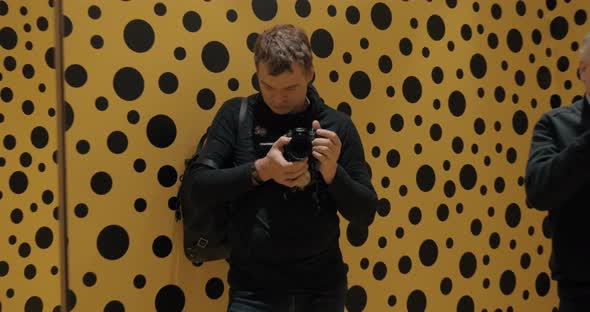 Visitors in Infinity Mirror Room of Japanese artist Yayoi Kusama alt