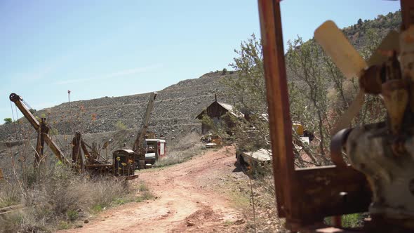 Old mining equipment along a street alt