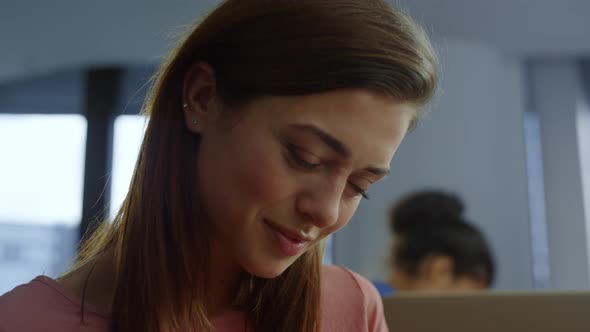 Businesswoman Sitting on Remote Workplace alt