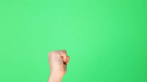 Male hand knocking on green background alt