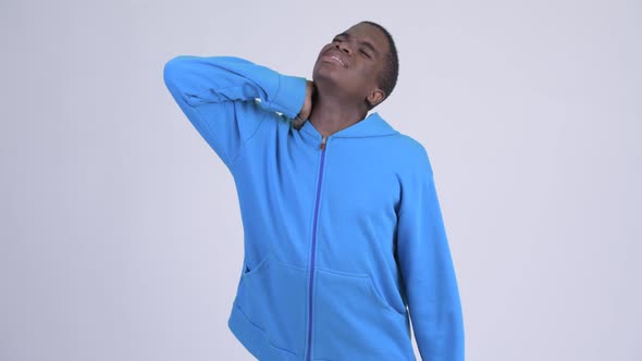 Young Stressed African Man Having Neck Pain alt