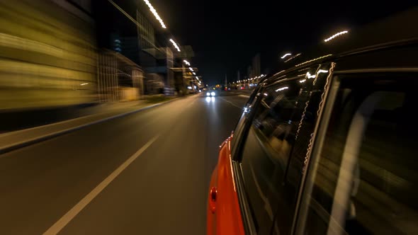 Drivelapse From Side of Car Moving on a Night Avenue in City Timelapse Hyperlapse alt