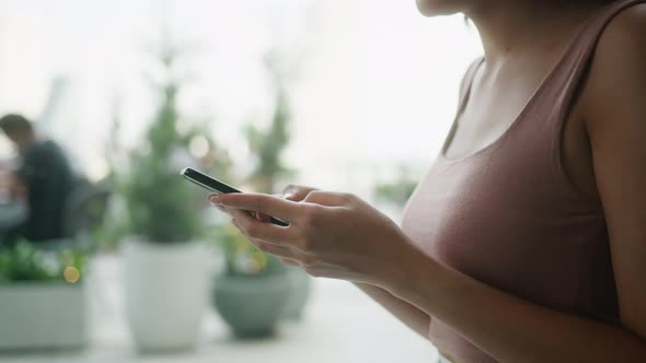 attractive smart casual female hand typing chat with smartphone tele communication alt