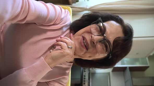 Old Senior Woman Has Video Meeting Call on Phone alt